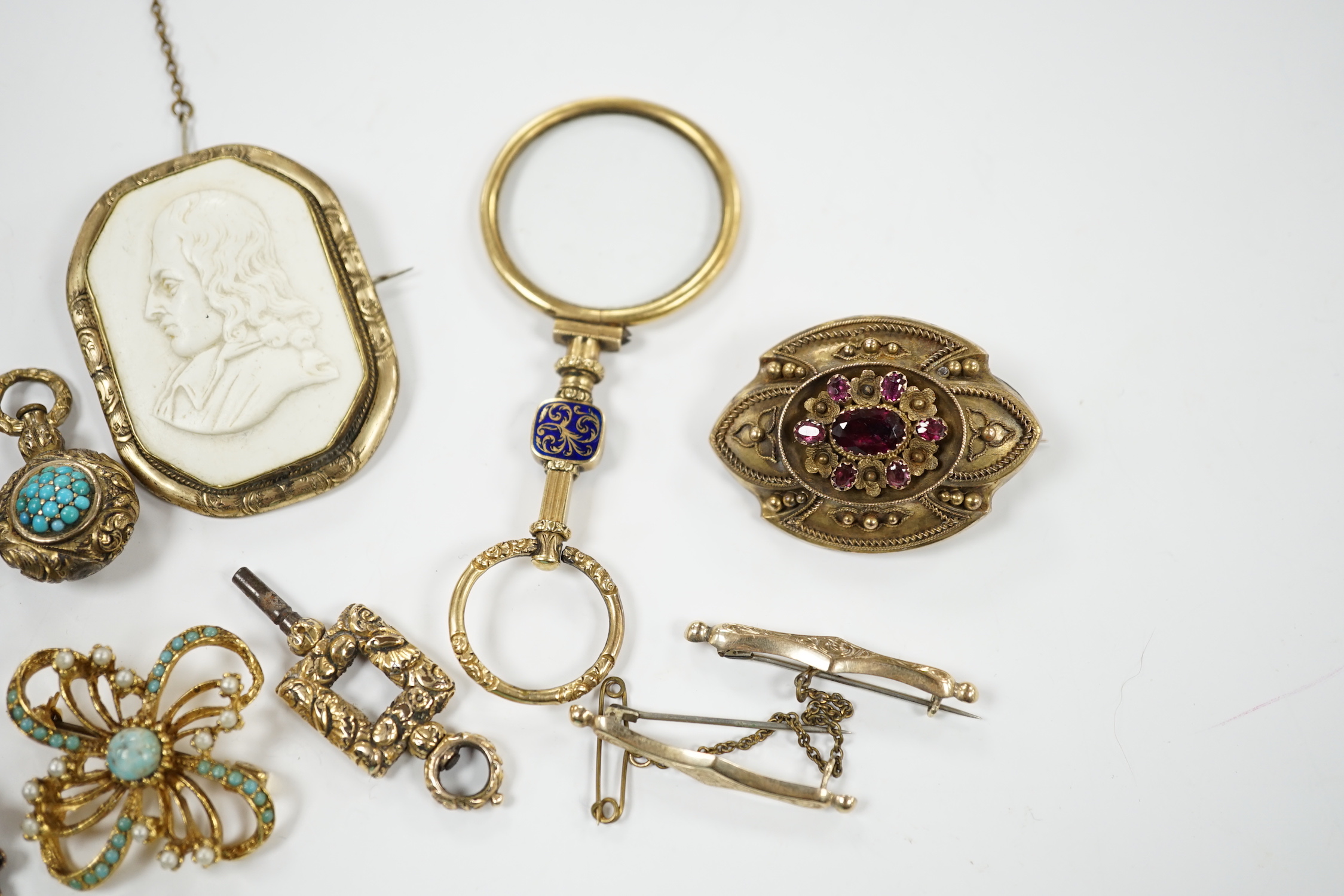 Two Georgian yellow metal mourning brooches, including garnet set and other items including garnet set brooch, watch key, eye glass, paste brooch, etc.
